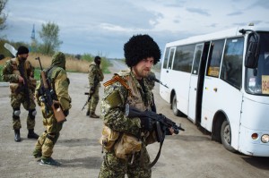 The Russian paramilitary group known as the Wolves' Hundred, with their commander Evgeny Ponomaryov in the foreground, block the road near the checkpoint not far from Slavyansk, in eastern Ukraine, April 20, 2014 Maxim Dondyuk