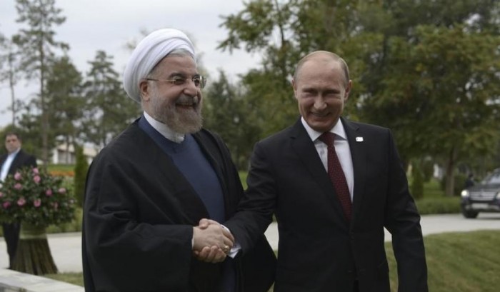 Russian President Vladimir Putin shakes hands with his Iranian counterpart, Hassan Rouhani, at a welcoming ceremony during a summit of Caspian Sea regional leaders in the southern Russian city of Astrakhan on September 29, 2014. ALEXEI NIKOLSKY/RIA NOVOSTI/KREMLIN/REUTERS