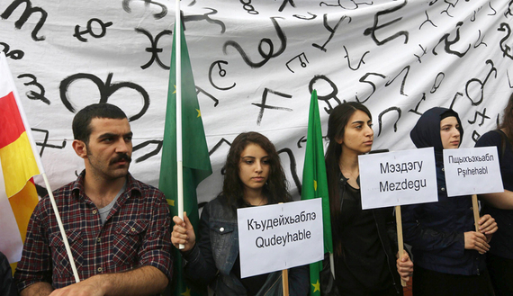 Turks of ethnic Circassian origin protest outside the Russian Embassy in Ankara on the 150th anniversary of the mass deportation and killings of ethnic Circassians by czarist Russia in the 19th century, May 21, 2014.  (photo by ADEM ALTAN/AFP/Getty Images) Read more: http://www.al-monitor.com/pulse/originals/2015/04/turkey-circassians-in-uproar-over-latin-alphabet.html#ixzz3YFTjqgLy