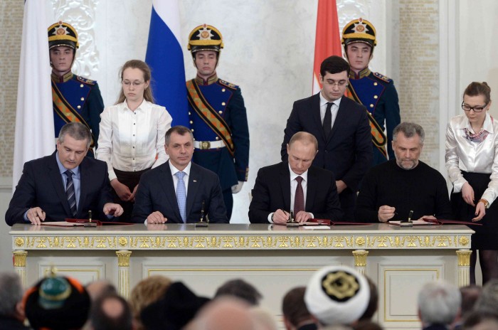 On March 18, 2014, Russian President Vladimir Putin signed treaties to annex Crimea. A year later, Putin acknowledged in a documentary that he planned and orchestrated the military takeover of the Crimean peninsula. Putin isn’t improvising in Ukraine. The big, geopolitical decisions in Russia don’t happen without his blessing or knowledge. Credit: Kremlin.ru